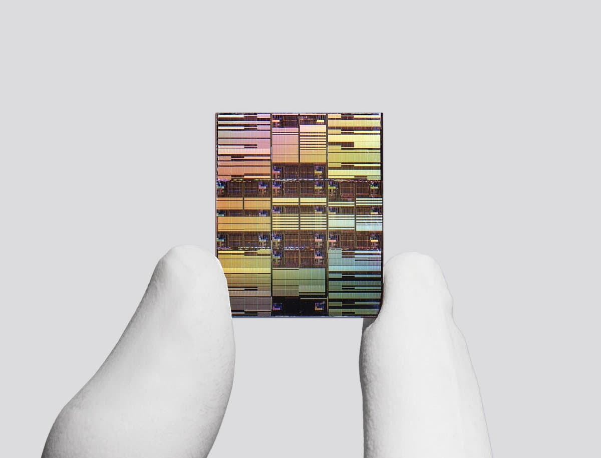 Researcher holding IBM’s sub-1nm node chip.